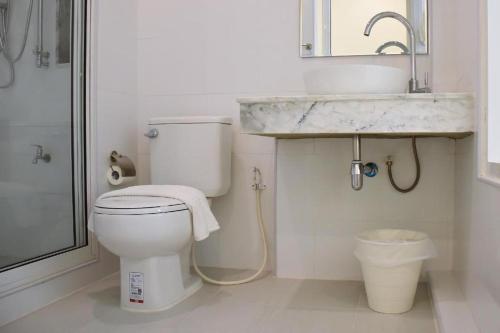 a bathroom with a toilet and a sink at Shunli Hotel - SHA Extra Plus in Phuket Town
