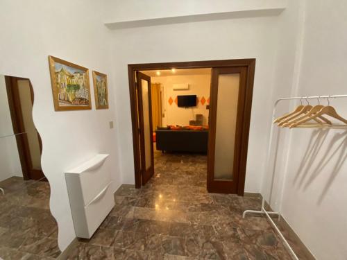 a hallway with a door leading to a living room at Hotel Ristorante Centosedici in Terracina