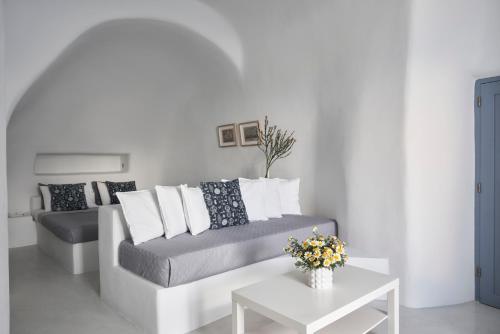 a living room with a couch and a table at Fava Eco Suites in Oia