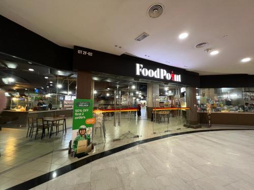 a grocery store with a food mart sign in a mall at The Shore Melaka in Melaka
