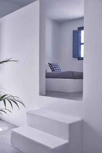 Ένα ή περισσότερα κρεβάτια σε δωμάτιο στο Fava Eco Suites
