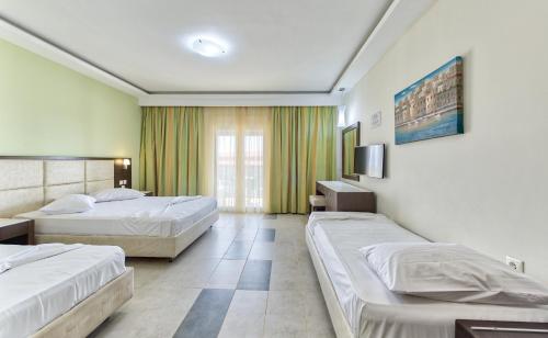 Postel nebo postele na pokoji v ubytování Majestic Hotel & Spa