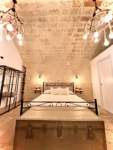 Postel nebo postele na pokoji v ubytování L’Antica Dimora