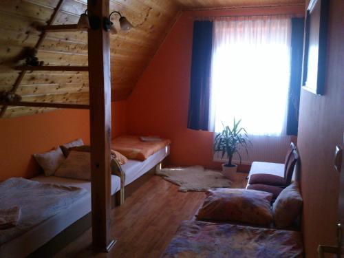 Postel nebo postele na pokoji v ubytování Agávé Apartman
