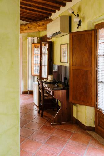 a kitchen with a table and chairs in a room at Villa Nottola in Montepulciano