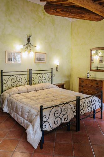 a bedroom with a large bed in a room at Villa Nottola in Montepulciano