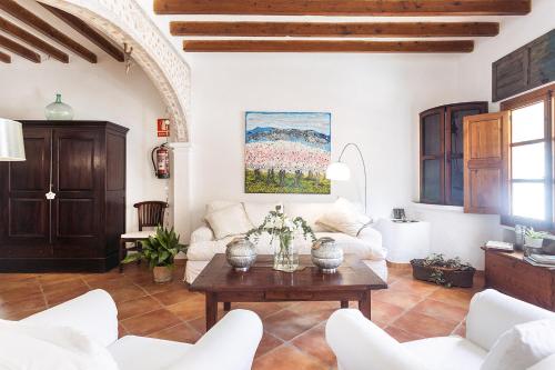 a living room with a couch and a table at Hotel Nord Boutique in Estellencs