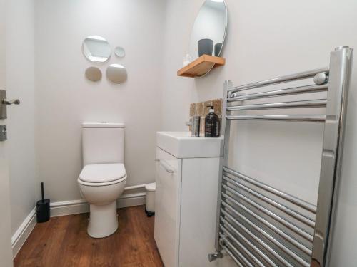 a bathroom with a toilet and a sink at The Annexe in Bridlington