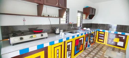 a kitchen with a lego inspired counter top at Johns villa in Sultan Bathery
