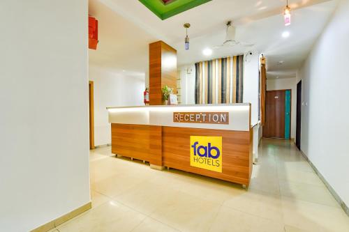 a reception area of a hotel with a reception desk at FabHotel Raj Ratna, Ahmedabad in Ahmedabad