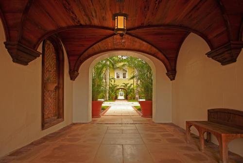 a hallway with an archway in a house at The Brazilian Court Hotel in Palm Beach