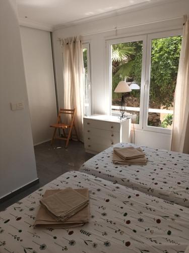 A bed or beds in a room at Great oportunity Costa Adeje Holiday apartment first sea line Free Wifi