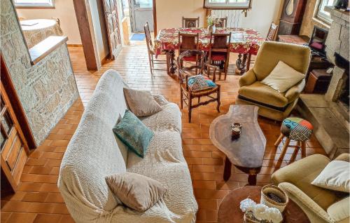 a living room with a couch and a table at 3 Bedroom Nice Home In Kerbors in Kerbors