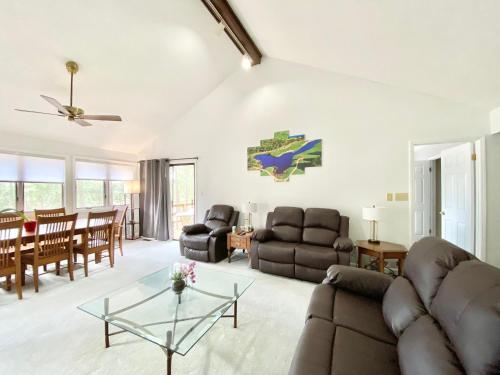 a living room with a couch and a table at Golf Front SFH, 3 BR, 2 BA, 4 beds, sleep 6 on Pinehurst #6 in Pinehurst