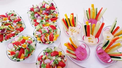 a group of bowls filled with different types of salads at Villa Bellavista Alba, B&B in Alba