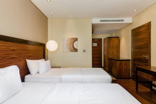 Ένα ή περισσότερα κρεβάτια σε δωμάτιο στο Protea Hotel by Marriott Ikeja Select