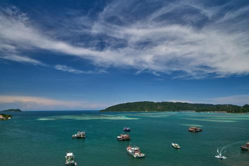 a group of boats in a large body of water at Le Meridien Kota Kinabalu in Kota Kinabalu