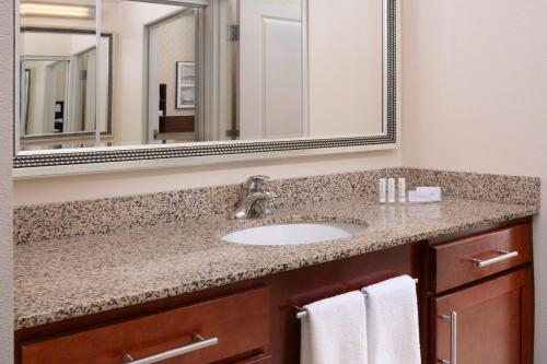 a bathroom with a sink and a mirror at Residence Inn by Marriott Dallas Plano The Colony in The Colony