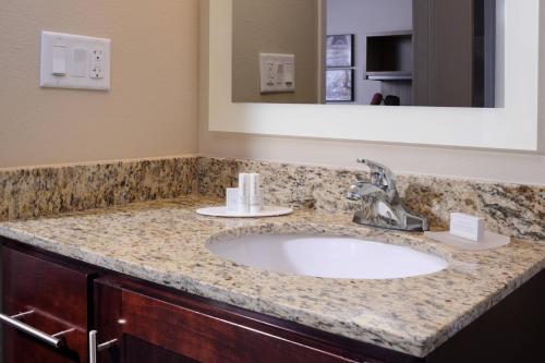 a bathroom with a sink and a mirror at TownePlace Suites by Marriott Laredo in Laredo