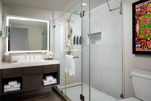 a bathroom with a shower and a sink at The Westin Cancun Resort Villas & Spa in Cancún