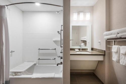 a bathroom with a sink and a mirror at TownePlace Suites by Marriott Whitefish in Whitefish