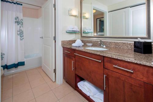 a bathroom with a sink and a mirror at Residence Inn Dover in Dover