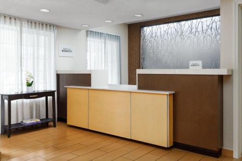 an office with a reception desk and a large window at Fairfield Inn and Suites by Marriott Houston The Woodlands in The Woodlands