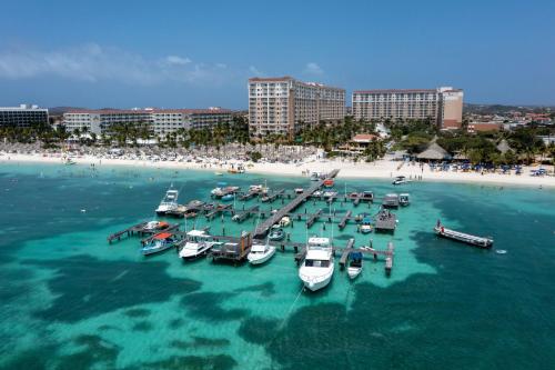 a group of boats in the water at a beach at Marriott's Aruba Ocean Club in Palm-Eagle Beach