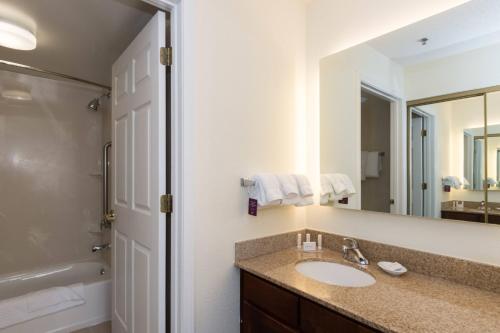 a bathroom with a sink and a mirror at Residence Inn by Marriott Lake Norman in Huntersville