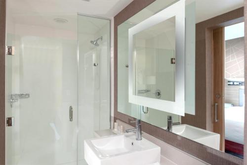 a bathroom with a sink and a mirror at SpringHill Suites by Marriott Denver Tech Center in Greenwood Village