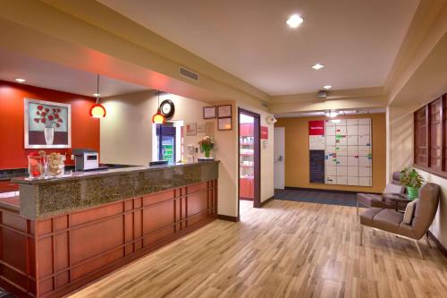 an office lobby with a reception counter and a waiting room at TownePlace Suites Boise West / Meridian in Meridian