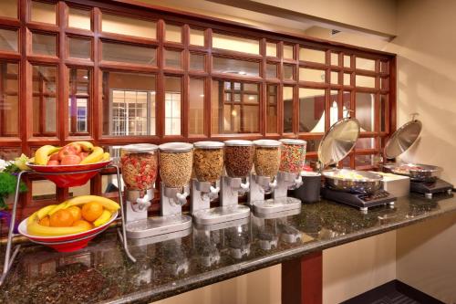 a kitchen with a counter with bowls of food at TownePlace Suites Boise West / Meridian in Meridian