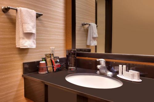 a bathroom with a sink and a mirror at Fairfield Inn & Suites by Marriott Salt Lake City Downtown in Salt Lake City