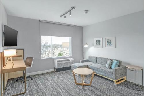 a living room with a couch and a table at TownePlace Suites by Marriott Dallas Rockwall in Rockwall