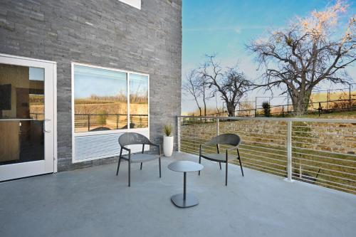 two chairs and a table on a patio at TownePlace Suites by Marriott Dallas Rockwall in Rockwall
