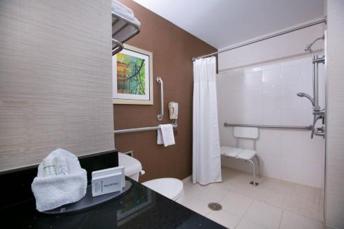 a bathroom with a toilet and a shower at Fairfield Inn & Suites by Marriott Dover in Dover