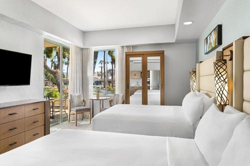 a hotel room with two beds and a television at Marriott's Desert Springs Villas I in Palm Desert