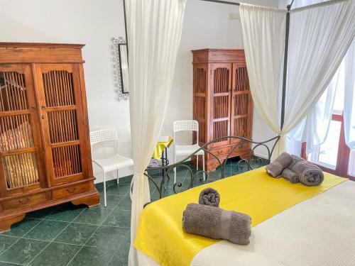 Кровать или кровати в номере Big Fish Alghero Guesthouse