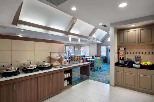 a kitchen with a counter with pots and pans at Residence Inn by Marriott Somerset in Somerset