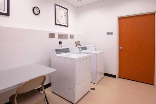 a clinic room with two machines and a orange door at Fairfield Inn & Suites by Marriott Venice in Venice