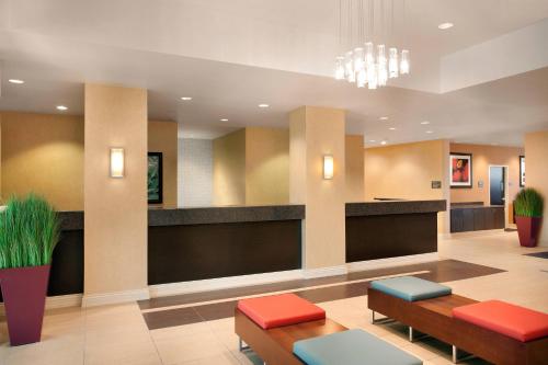 a lobby of a hospital with benches andools at Residence Inn by Marriott Las Vegas Hughes Center in Las Vegas
