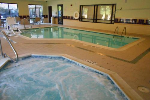 a large swimming pool with a hot tub at SpringHill Suites Morgantown in Morgantown