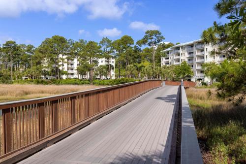 a bridge over a road with buildings in the background at Marriott's SurfWatch in Hilton Head Island