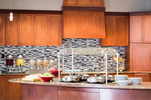 a kitchen with a counter with pots and pans at Residence Inn by Marriott National Harbor Washington, D.C. Area in National Harbor