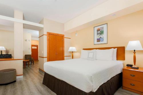 a hotel room with a large bed and a desk at Fairfield Inn & Suites Temecula in Temecula