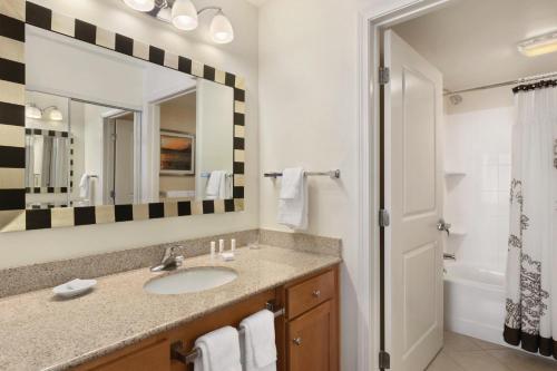 a bathroom with a sink and a mirror at Residence Inn by Marriott Newport Middletown in Middletown
