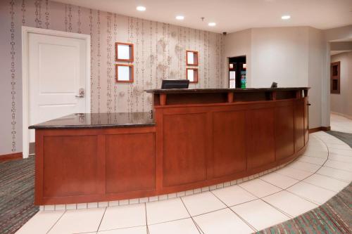 a wooden reception desk in a waiting room at Residence Inn by Marriott San Antonio North Stone Oak in San Antonio
