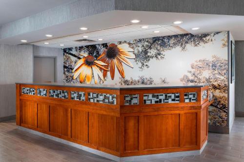 a lobby with a flower mural on the wall at Residence Inn by Marriott Bloomington by Mall of America in Bloomington