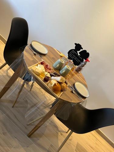 a wooden table with food on top of it at La Perle d'Alsace in Bernardswiller