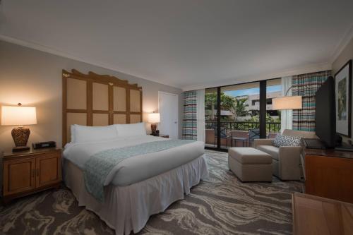 a hotel room with a bed and a television at Marriott's Maui Ocean Club - Molokai, Maui & Lanai Towers in Lahaina